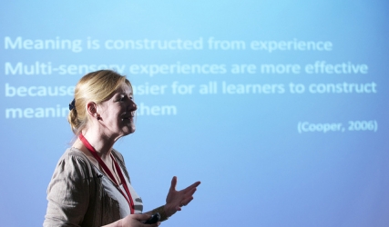 a woman giving a teaching development seminar